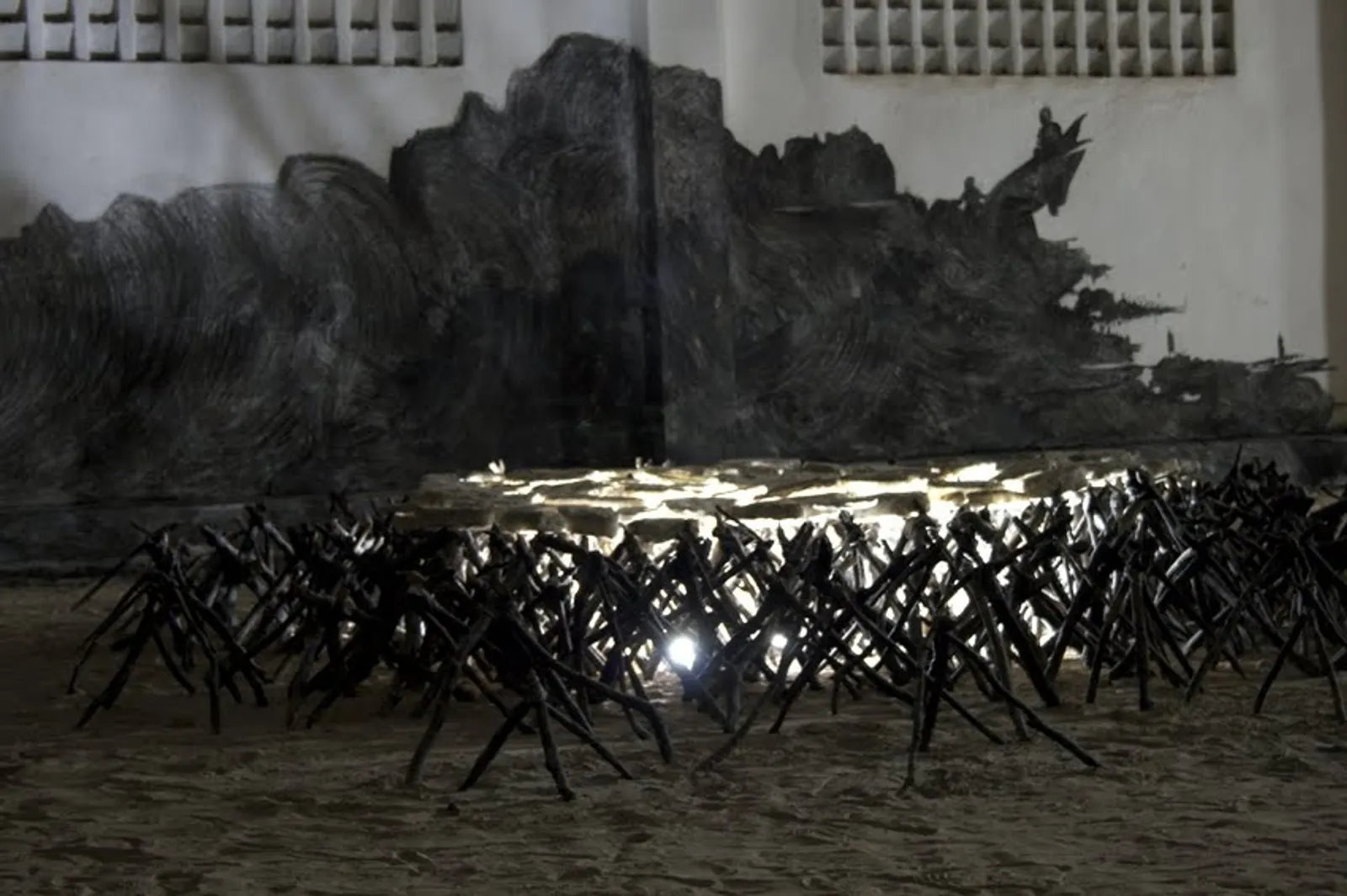 The Servants' Bed, 2009 — installation view against the charcoal wall drawing of the River Niger