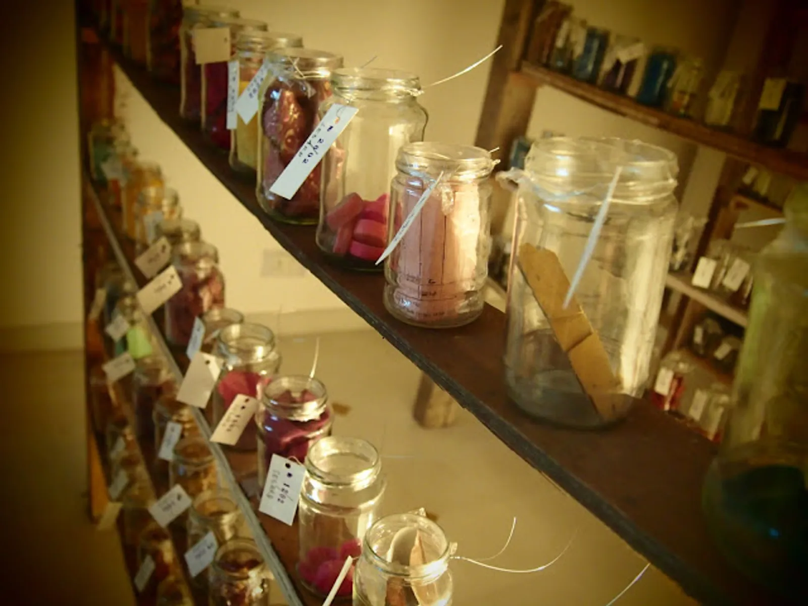 Odds and Ends, 2012 — jars along a raking shelf, each labelled with the date its contents were found