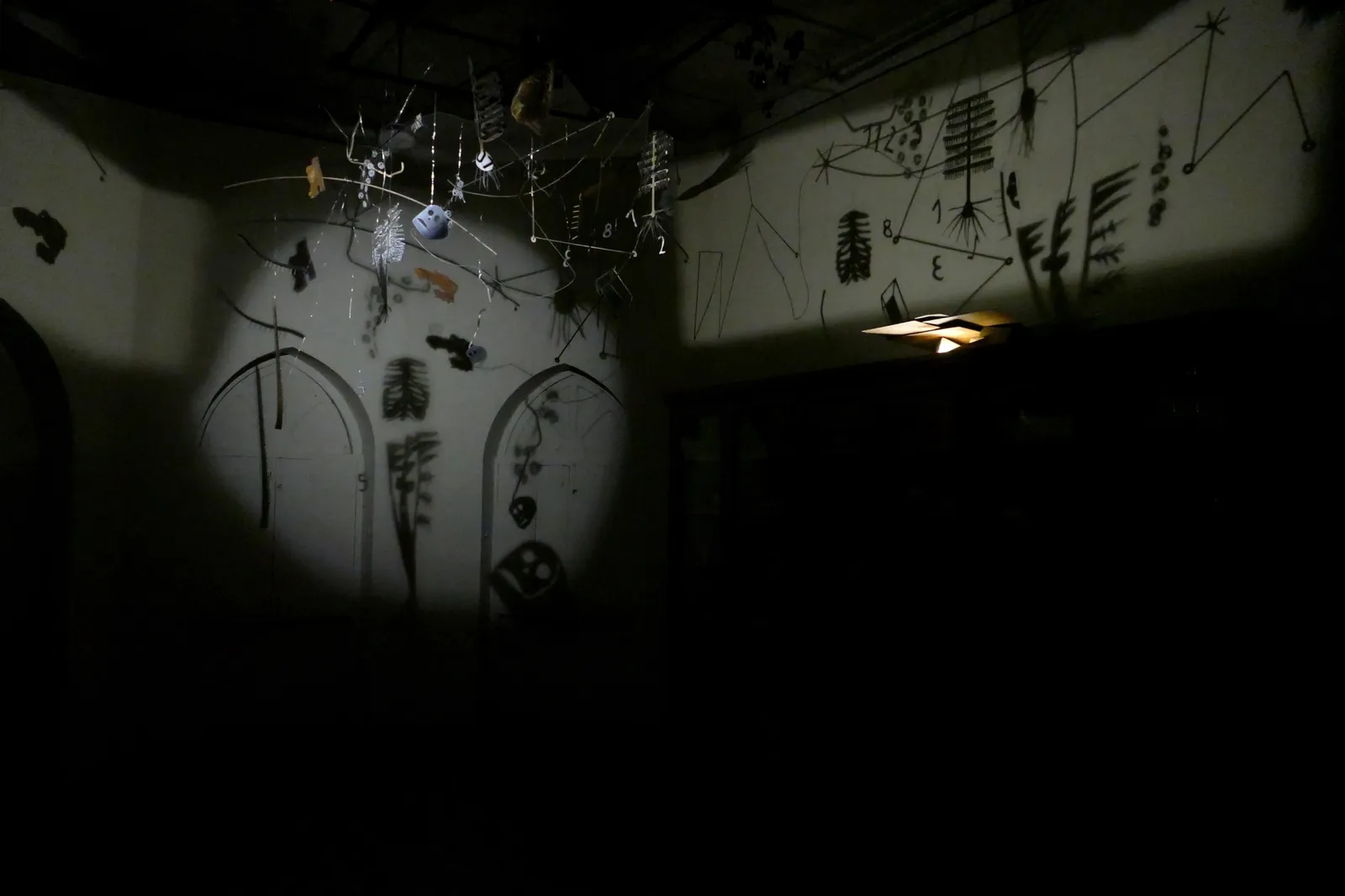Residuum, 2018 — suspended found materials, wire and light