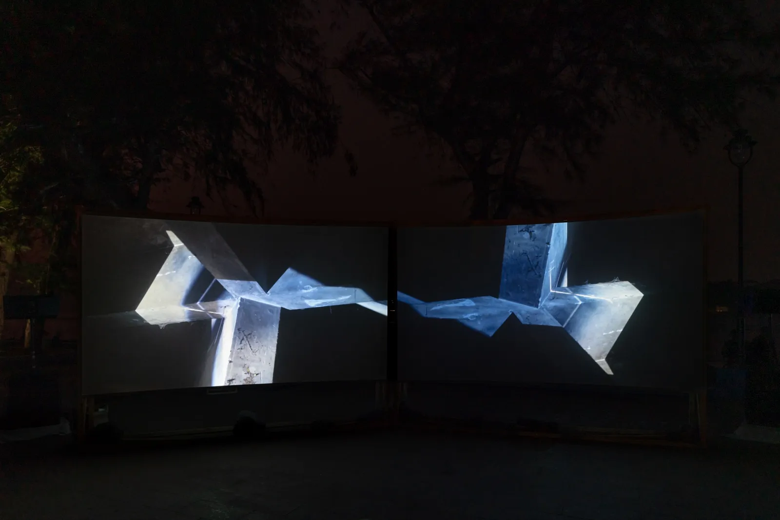 In Praise of Shadows, 2022 — two-channel video projection, installation view