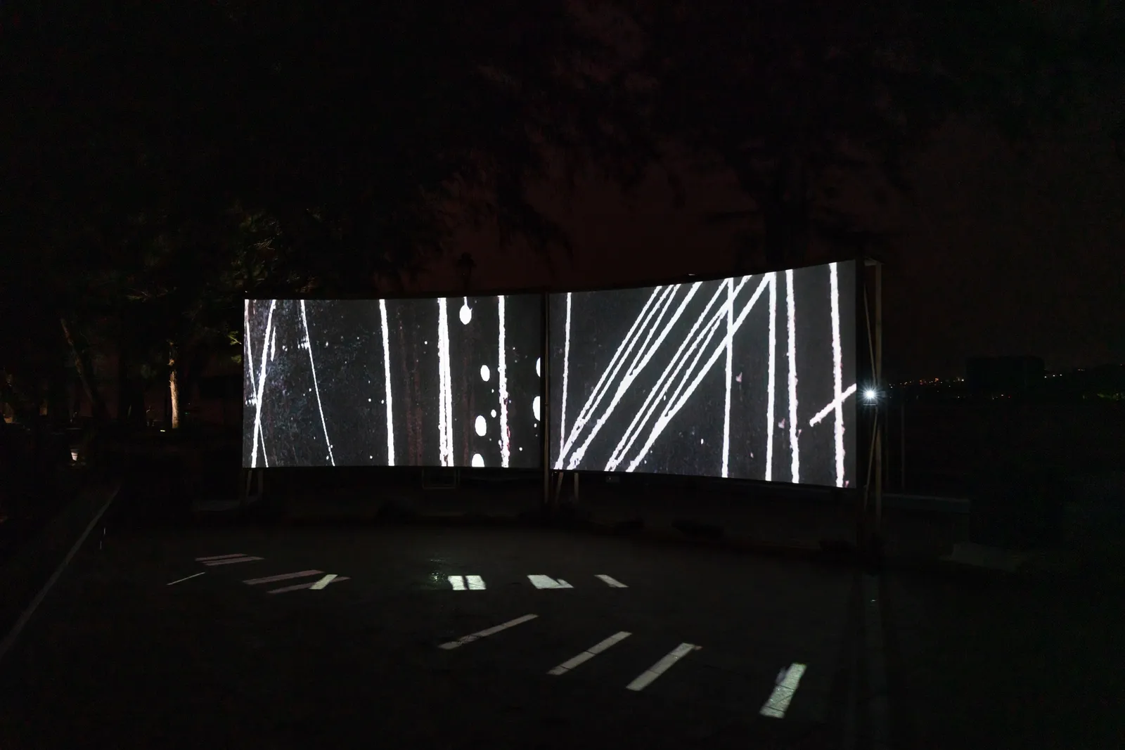 In Praise of Shadows, 2022 — two-channel video projection, installation view